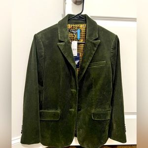 Exceptional tailoring and heritage style define luxuriously soft cord blazer.